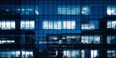 Pattern of office buildings windows illuminated at night. Glass architecture ,corporate building at night - business concept. Blue graphic filter. : Generative AI